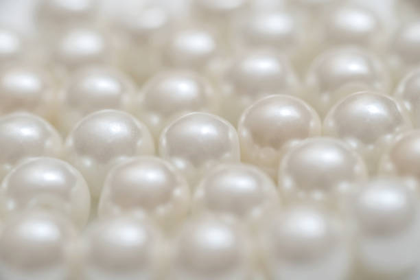 istock Background from pearls. White round luxury jewel. 1296703944