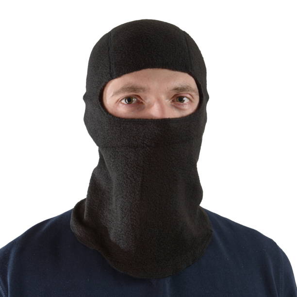istock brunette man in a blue shirt with a black balaclava 1296704573