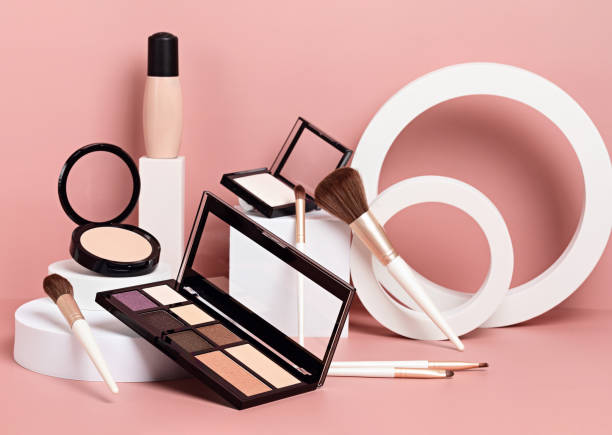 istock Make up products prsented on white podiums on pink pastel background. 1296704647