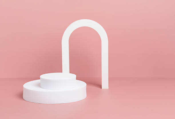 istock Podium, stand, platform for product presentation. Abstract pink background and white shapes. Mockup for branding and packaging presentation 1296705479