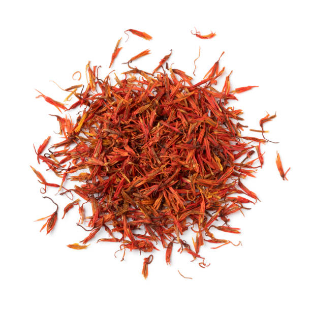 Heap of dried safflower leaves isolated on white background Heap of dried safflower leaves, substitute for saffron, close up isolated on white background substitute for saffron stock pictures, royalty-free photos & images