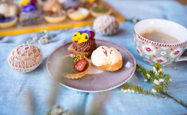 istock Cup of coffee and dessert on table, close-up. 1296710952