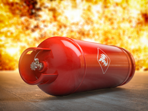 Gas tank or bottle on explosive flame and fire background. Danger of using gas concept, 3d illustration
