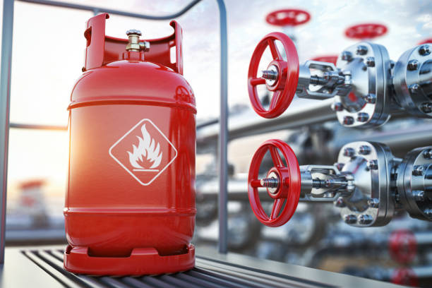 production, delivery and filling with natural gas of lpg gas bottle or tank. - gas tank imagens e fotografias de stock