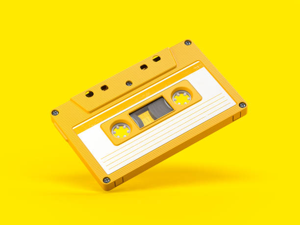 Yellow vintage audio cassette on yellow background. Yellow vintage audio cassette on yellow background. 3d illustration yellow tape audio stock pictures, royalty-free photos & images