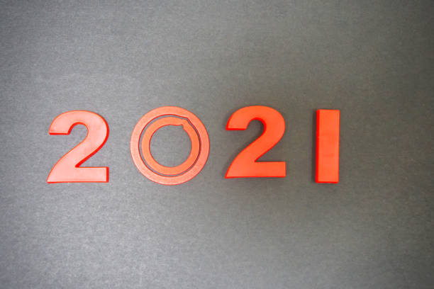 istock Loading new year 2021 with hand putting number one 1296717311