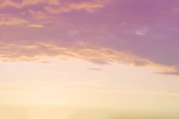 istock sunset background. sky with soft and blur pastel colored clouds.  gradient cloud on the beach resort. nature. sunrise.  peaceful morning. Instagram toned style 1296718688