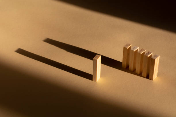 istock shadows from the wooden blocks on a beige background. Abstract 1296719639