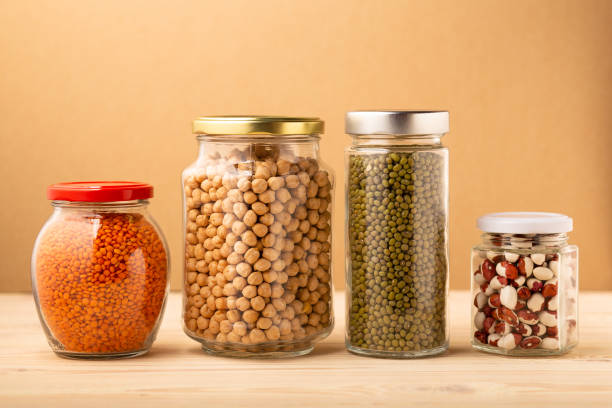 istock Different legumes in glass jars, storage in pantry kitchen 1296719736