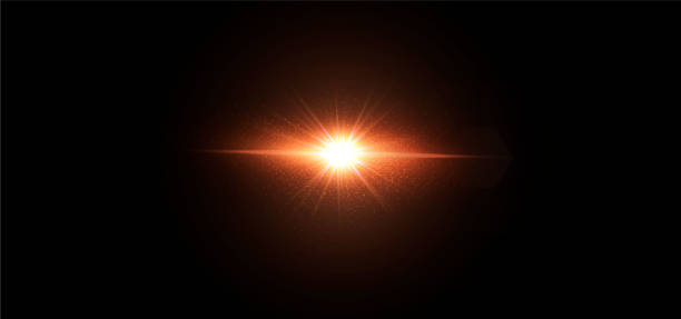istock Shining sun with glare and flare in a dark background 1296719754