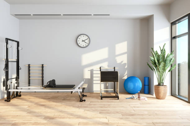 Pilates Reformer Machine With Tower And Other Pilates Equipments In Personal Training Studio.