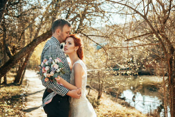 istock Happy bride and groom on their wedding day 1296720251