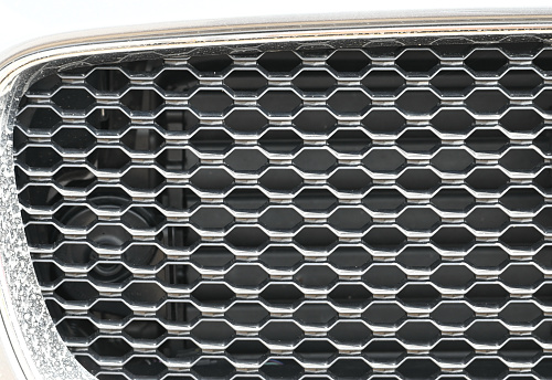 Front grille of white car.