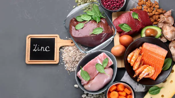 Healthy sources of zinc. Healthy eating and diet concept. Natural products containing zinc, dietary fiber and vitamins. Top view, copy space, chalkboard