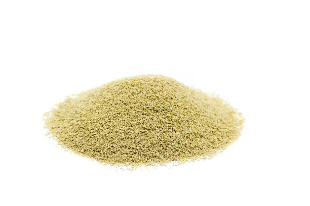 istock Dry baker's yeast isolated on white background 1296724026