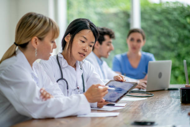 istock Medical professionals working together in a meeting 1296726347
