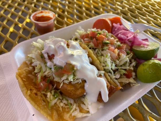 istock Fish and carne asada tacos with lime and salsa 1296728817