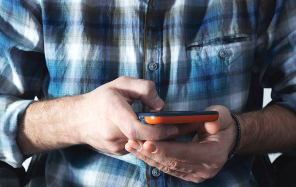 istock A man holds a smartphone, Online chat chatting on application communication digital media website and social network. 1296728963