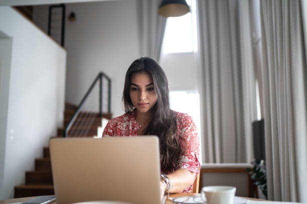 istock Young woman working from home 1296729976