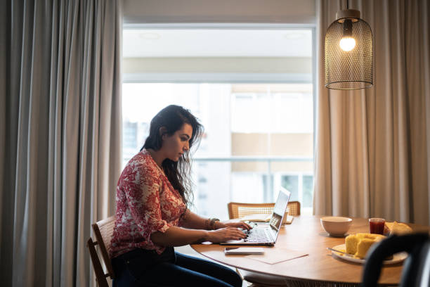 istock Young woman working from home 1296729978