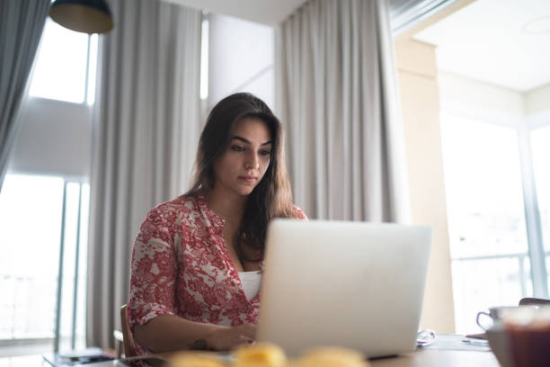 istock Young woman working from home 1296729984