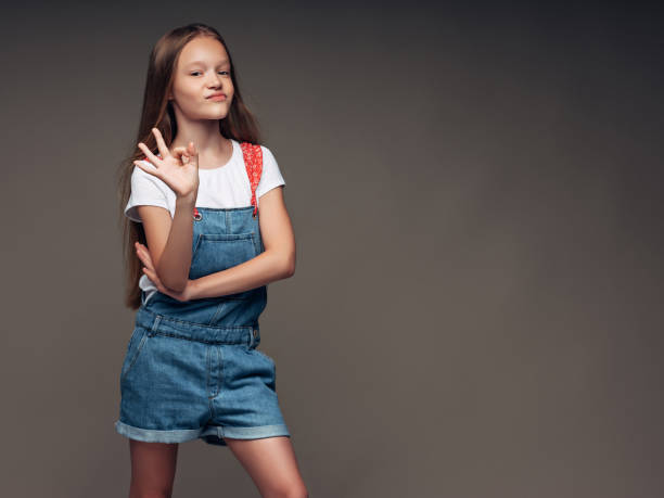 Little girl wearing bib overalls