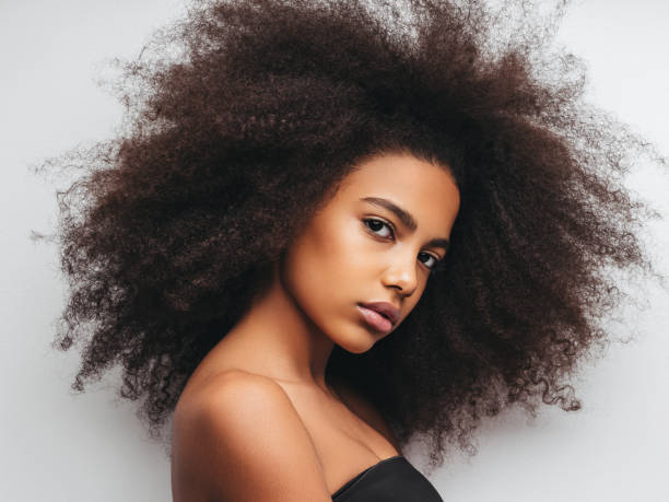 istock Beautiful girl with curly hairstyle 1296730944
