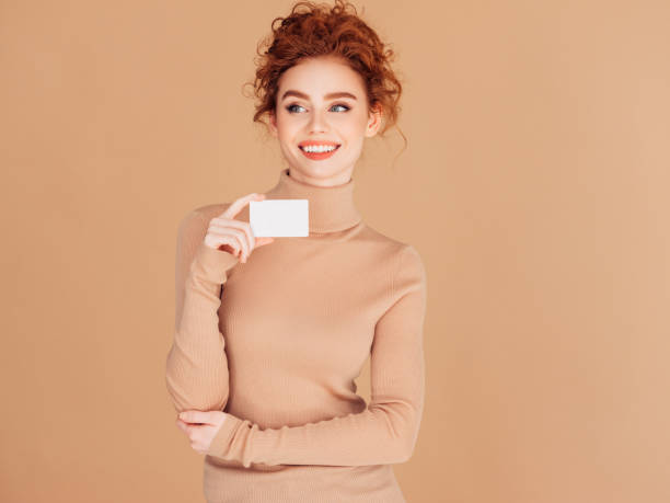 istock Beautiful woman holds placard 1296731238