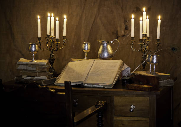 istock Old medieval desk with pen and book 1296731417