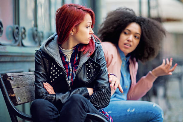 istock Girlfriends in conflict are sulking each other 1296732016