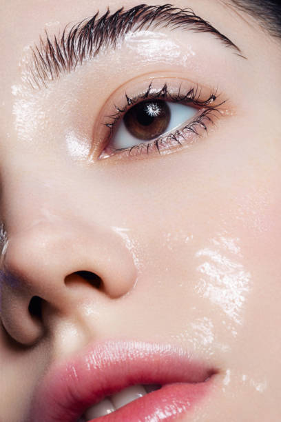 istock Beautiful young woman with moisturizing gel on her face 1296732490