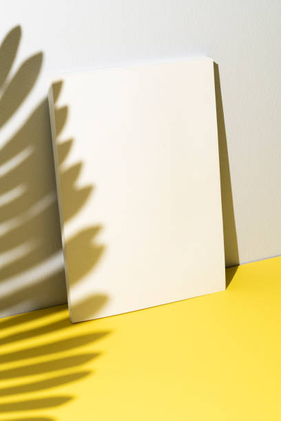 istock White book cover mockup, template on yellow and white background 1296732591