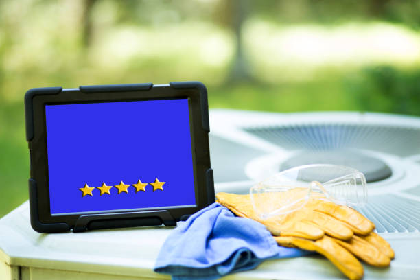 Five Star Reviews. Air conditioning service company with 5 gold star reviews on a digital tablet. consumer confidence photos stock pictures, royalty-free photos & images