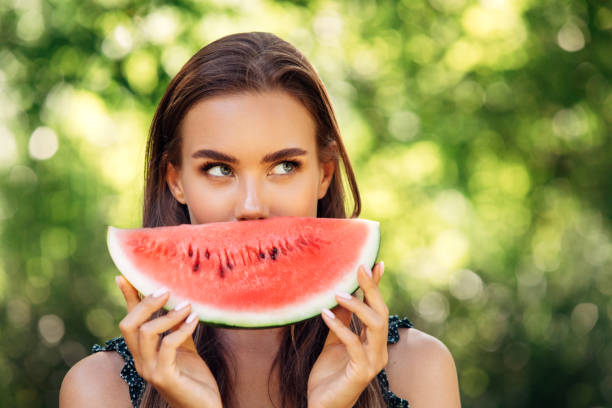 istock Enjoying sunny day wile eating watermelon 1296734299