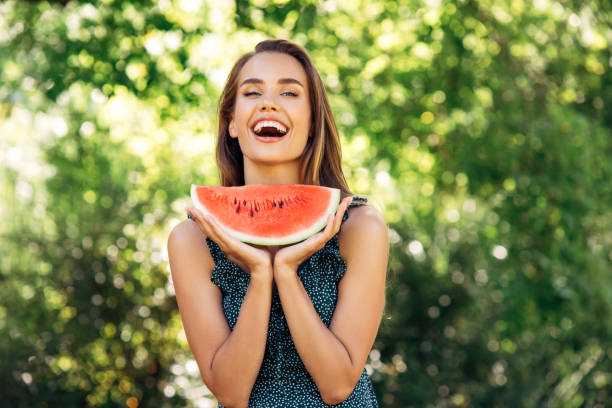 istock Enjoying sunny day wile eating watermelon 1296734366