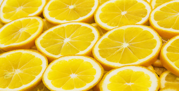 istock background of sliced lemon circles 1296735356