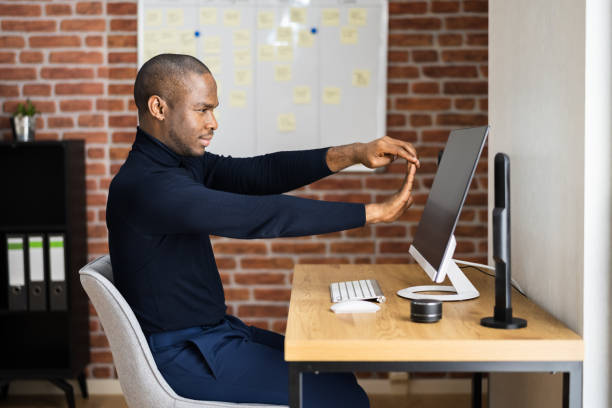 istock African American Man Doing Stretch Exercise In Office 1296736889