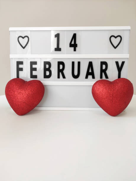 istock Happy Valentines Day concept, red glitter hearts and lightbox on white background 1296739154