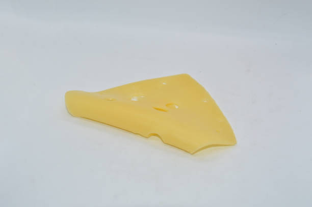 istock Yellow cheese with holes on white the background 1296740486