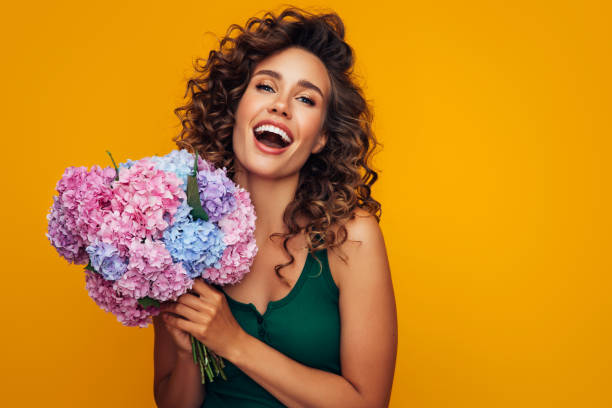 istock Beautiful woman with flowers 1296740676