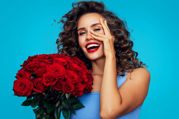 istock Beautiful woman with flowers 1296741387