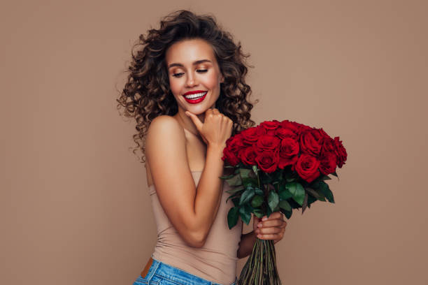 istock Beautiful woman with flowers 1296741484