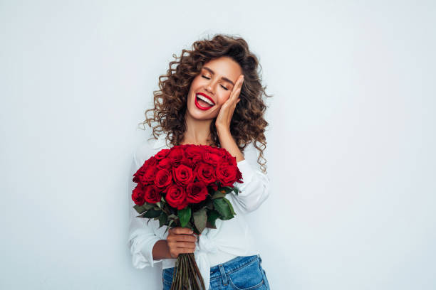 istock Beautiful woman with flowers 1296741495