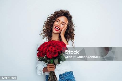 istock Beautiful woman with flowers 1296741495