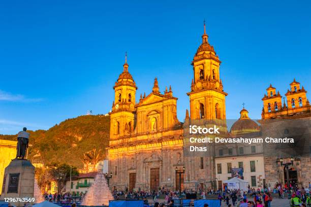 Bogota Colombia The North Eastern Corner Of Plaza Bolivar In The Andean Capital City The Upper Half Of The Ninteenth Century Catedral Primada Is Turned To Gold By The Setting Sun Stock Photo - Download Image Now
