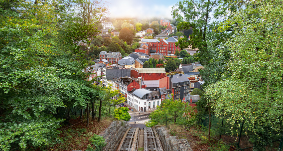 Aerial view of city of Spa. View from above, rail track of cable car at the Thermes in Spa. Green trees on the side. Panoramic landscape with city.