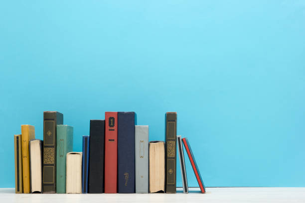 istock Books on wooden desk table and abstract background. Education background. Copy Space. Back to school. 1296745071