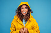 Smiling beautiful woman in raincoat