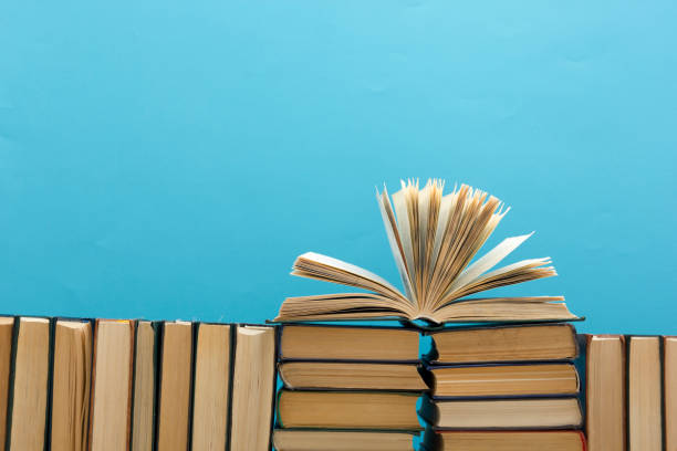 istock Books on wooden desk table and abstract background. Education background. Copy Space. Back to school. 1296746301