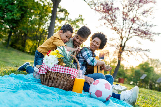 istock Happy family spending a spring day on picnic 1296751993